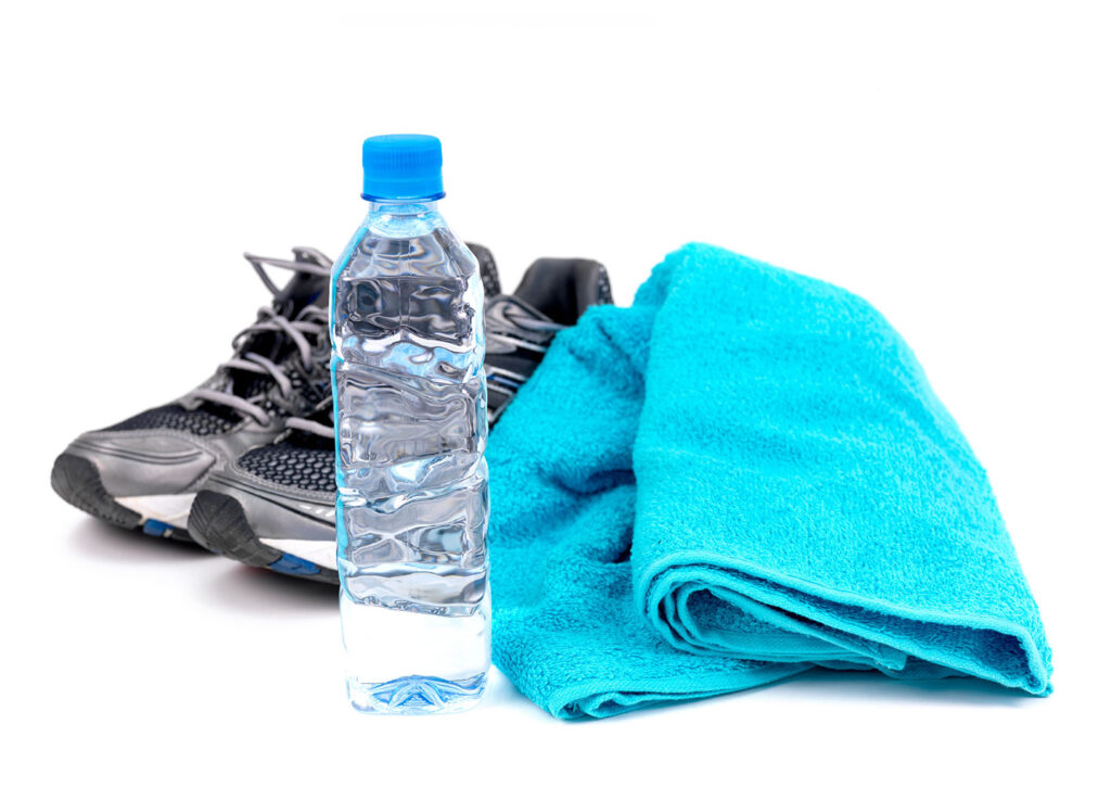 Gym shoes towel and water bottle
